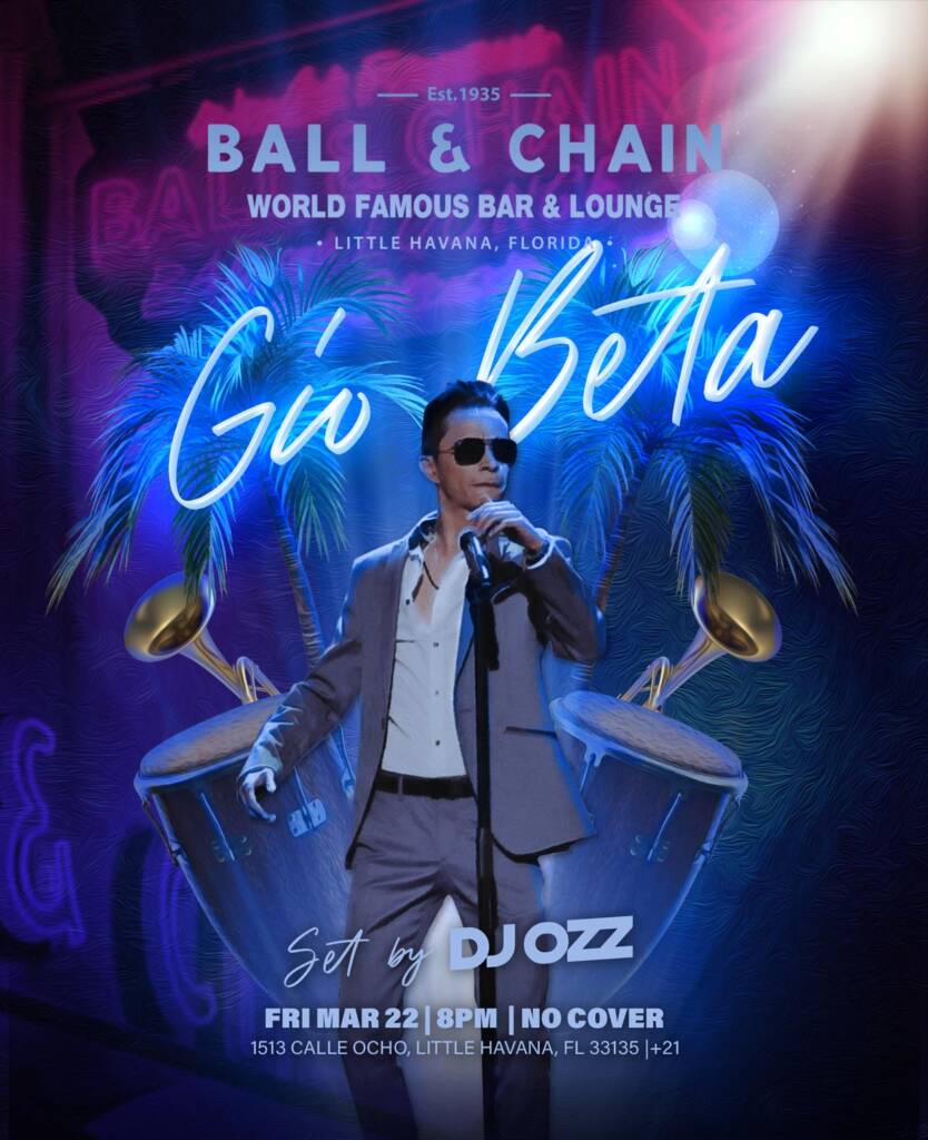 Gio Beta performing in front of his name in neon lights