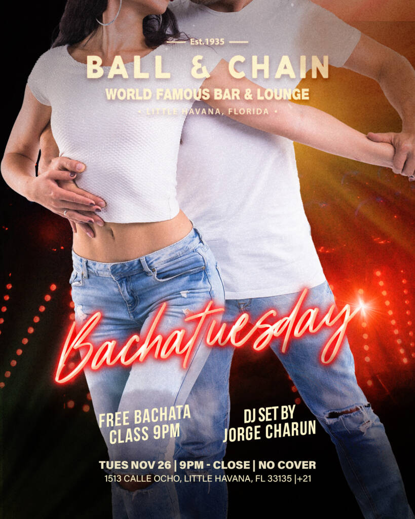 torsos of a couple in jeans and white t-shirts dancing bachata