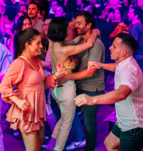 People dancing salsa at ball and chain