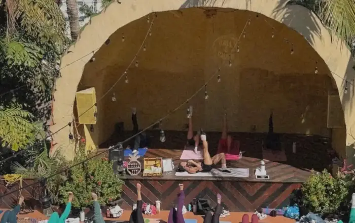 People doing pilates on the pineapple stage at ball & chain