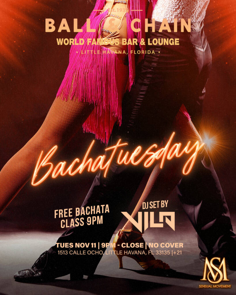 woman in a pink dress and man in slacks dancing bachata from the waist down