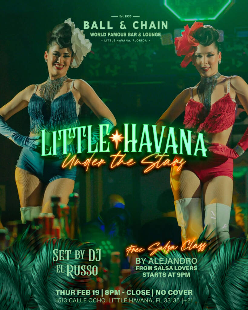 two show girls in red and blue strutting on stage