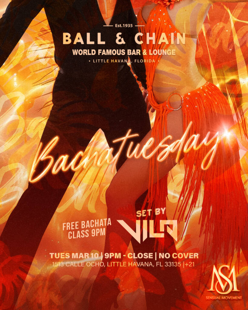 couple dancing salsa in front of a fire