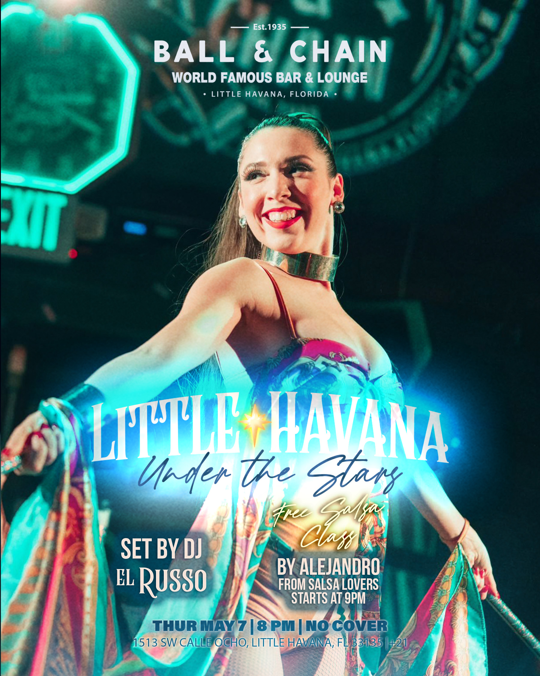 a showgirl on stage spreading her arms