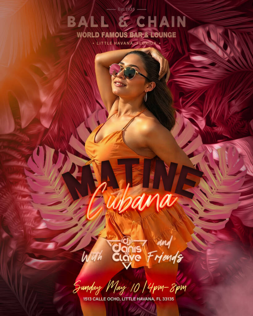 woman in an orange sundress and sunglasses dancing