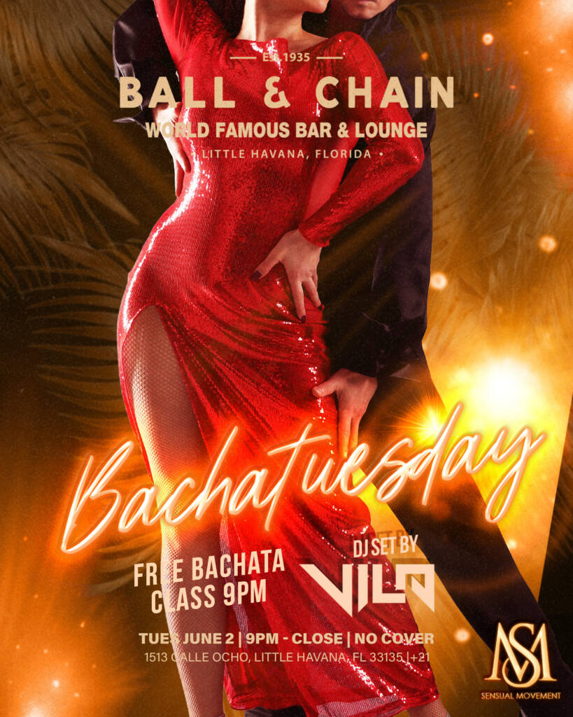 woman in a red dress and man in a black suit dancing bachata