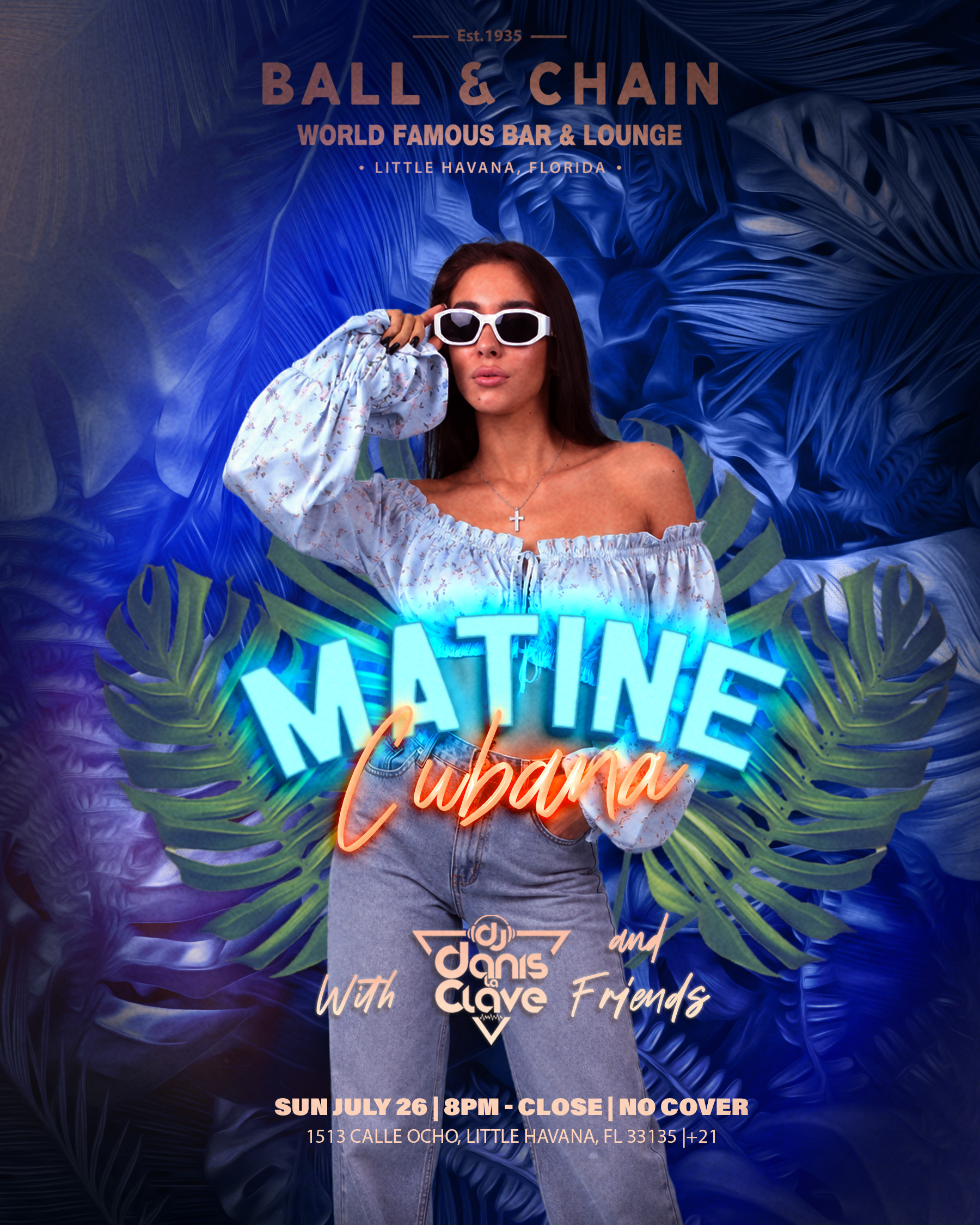 woman in sunglasses and jeans posing in front of palm fronds
